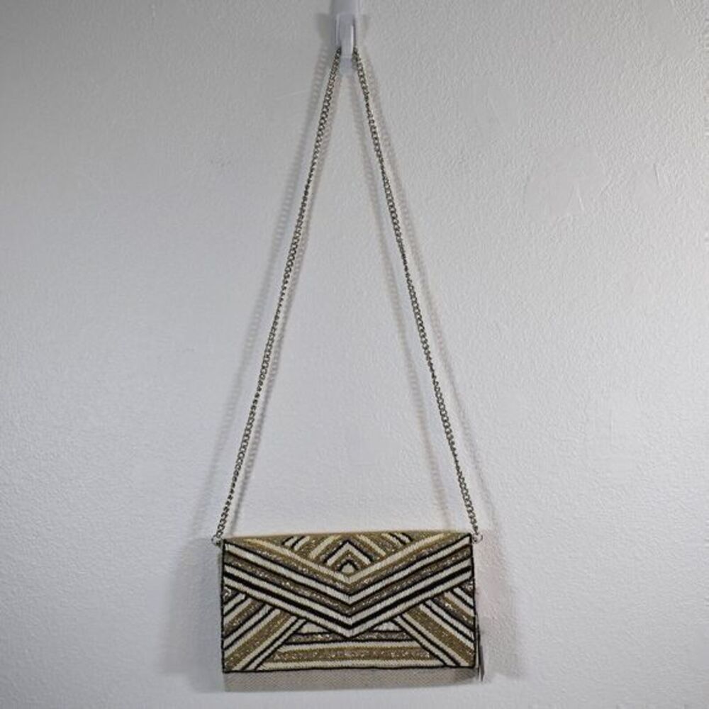 America and Beyond Embellished Convertible Clutch w/ Strap New w/ Tags has flaws